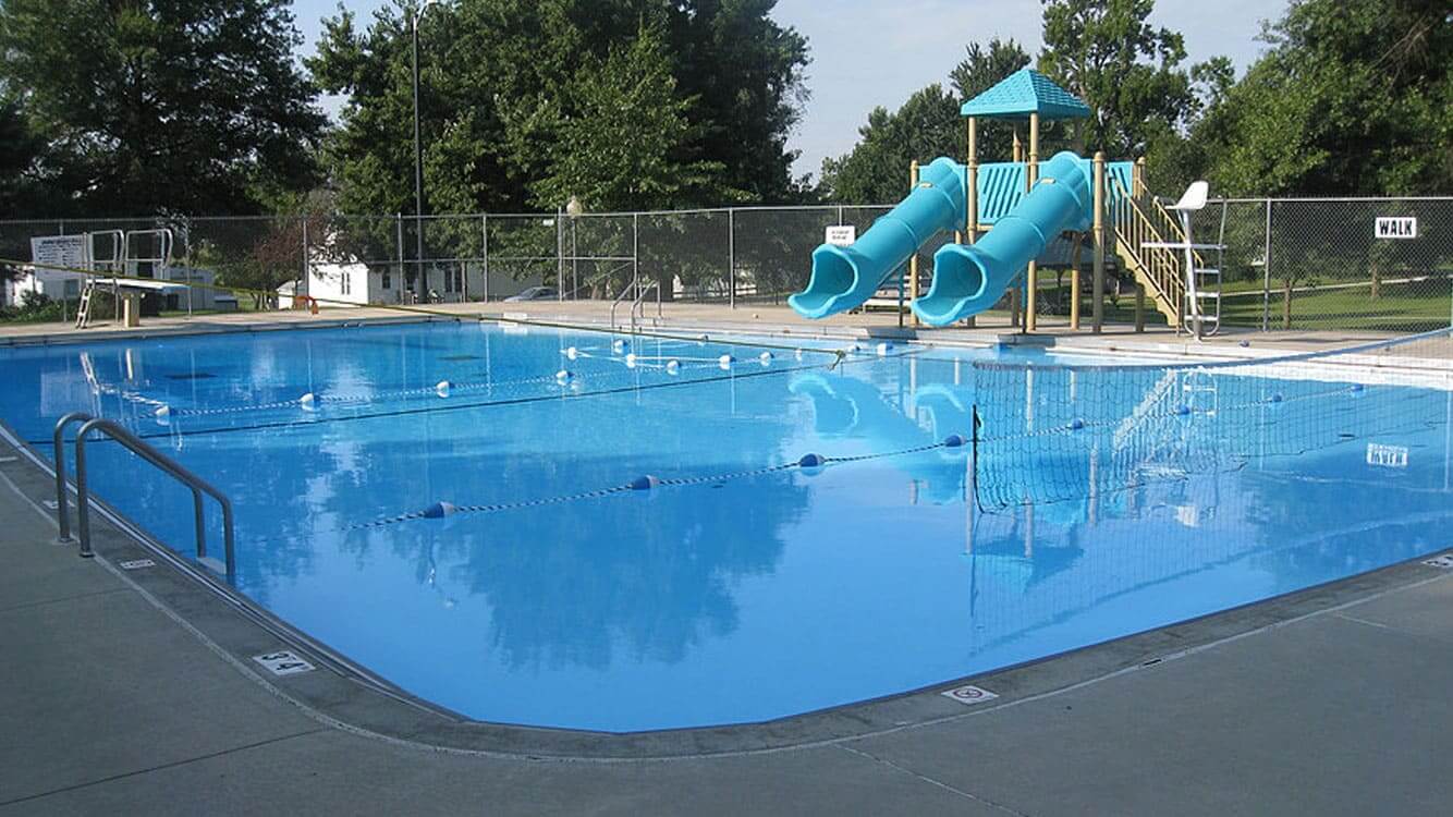 A serene Iowa swimming pool with clean lines and high-quality lighting.